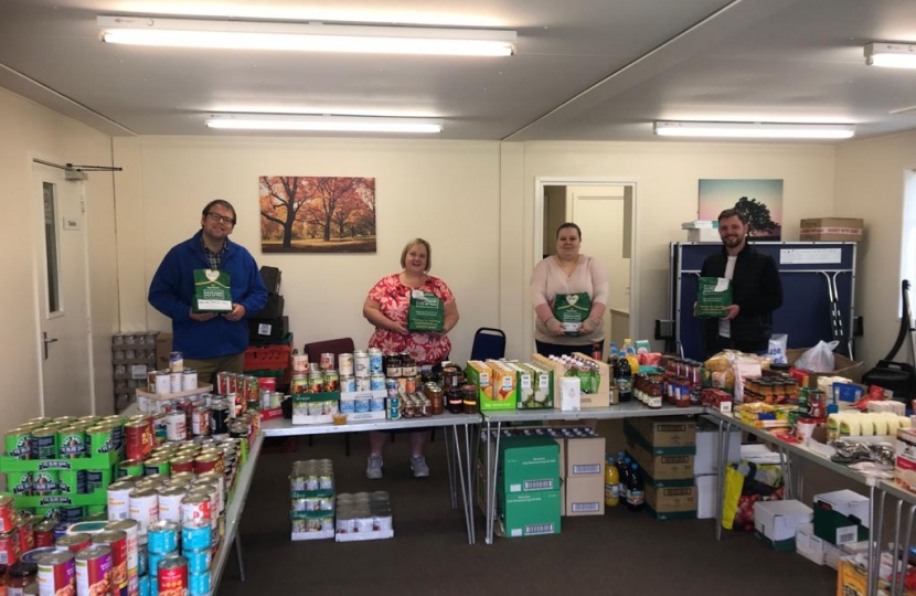 Mark Fletcher, new County Councillor James Barron and volunteers at the Tibshelf food bank.