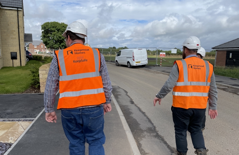 Mark Fletcher in High Vis jacket and speaking to keepmoat homes developers