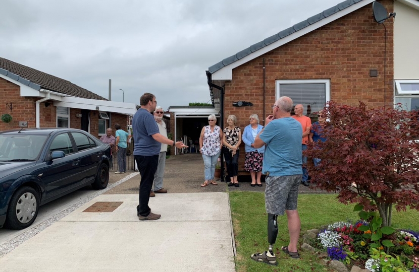 Mark speaking to residents in Hilcote about bus services