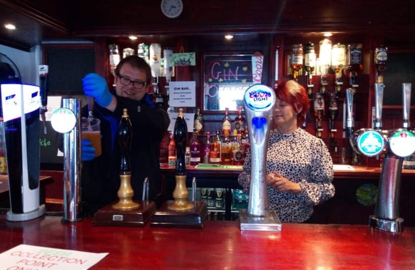 Mark Fletcher MP pours a pint under Kay Towers' tutelage