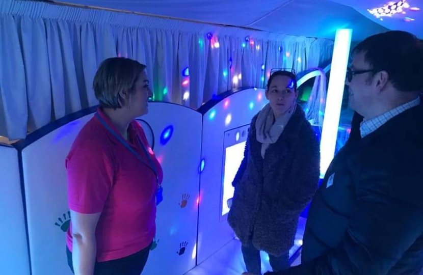 Mark Fletcher MP aboard the sensory bus with representatives from the Riley Foundation and SEND'S