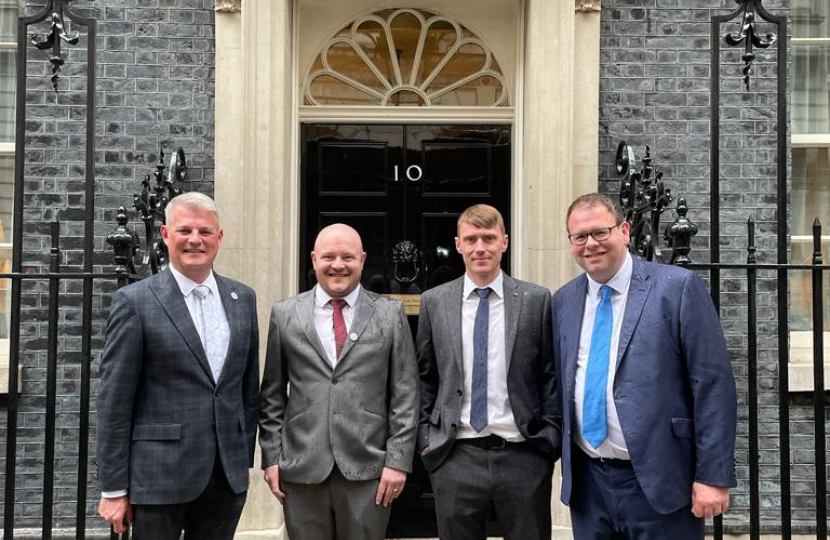 Bottled Up Blokes outside No 10