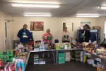 Mark Fletcher, new County Councillor James Barron and volunteers at the Tibshelf food bank.