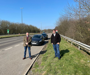 Mark Fletcher and Leader of Derbyshire County Council Barry Lewis at site of the proposed link road.