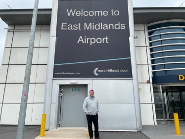 Mark Fletcher Outside the Sign for East Midlands Airport