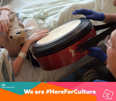 child in hospital with a drum