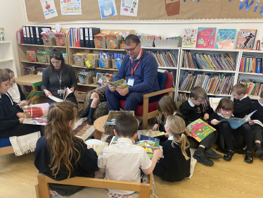 Mark reading with Children at the Green Infant School