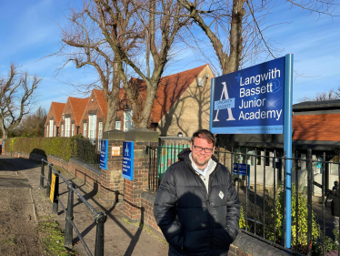 Langwith Bassett Academy standing outside by sign