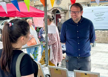 Talking to a young person at the market